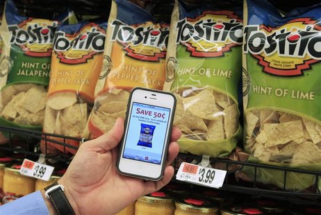 A customer with the Scan It! Mobile app on his iPhone shows a coupon at Stop and Shop supermarket in Braintree A customer with the Scan It! Mobile app on his iPhone shows a coupon at Stop and Shop supermarket in Braintree