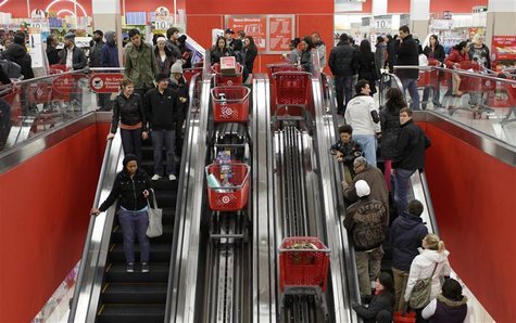 Shoppers ride an escalator at a Target Store in Chicago Shoppers ride an escalator at a Target Store in Chicago