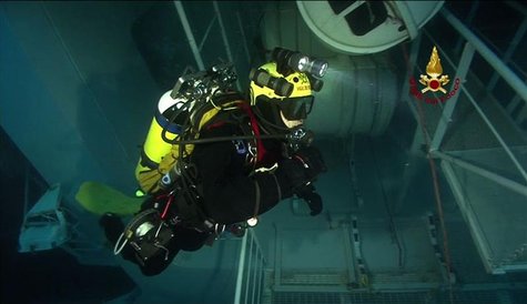 Scuba diver inspects inside of Costa Concordia cruise ship which ran aground off west coast of Italy at Giglio island in this still image ta Scuba diver inspects inside of Costa Concordia cruise ship which ran aground off west coast of Italy at Giglio island in this still image ta