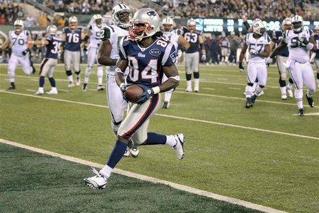New England Patriots wide receiver Deion Branch scores a touchdown against the New York Jets during fourth quarter of their NFL football gam New England Patriots wide receiver Deion Branch scores a touchdown against the New York Jets during fourth quarter of their NFL football gam