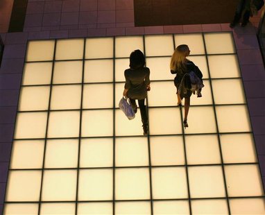 Women walk through a shopping mall in San Francisco Women walk through a shopping mall in San Francisco