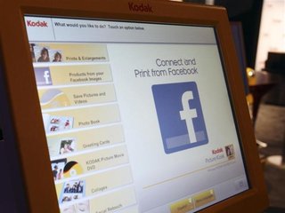 A Facebook logo is displayed on Kodak photo kiosk during the 2012 International Consumer Electronics Show (CES) in Las Vegas