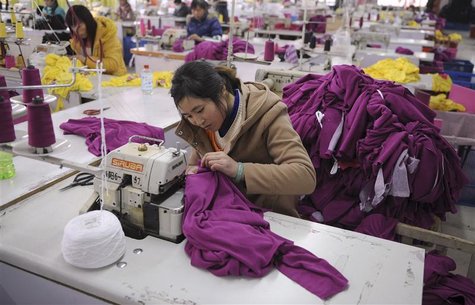 Employees work at a garment factory in Wuhu Employees work at a garment factory in Wuhu
