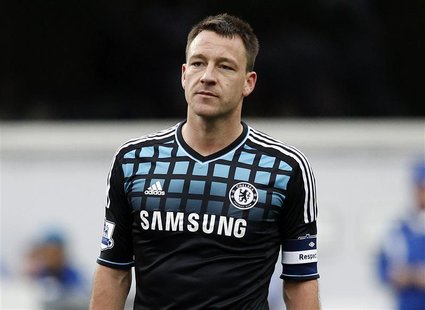 John Terry of Chelsea looks over at the Queens Park Rangers fans as they chant insults at him during an injury break in their FA Cup soccer John Terry of Chelsea looks over at the Queens Park Rangers fans as they chant insults at him during an injury break in their FA Cup soccer
