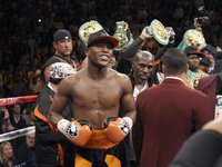 Floyd Mayweather Jr. of the U.S. stands in the ring before fighting WBC welterweight champion Victor Ortiz, also of the U.S., at the MGM Gra