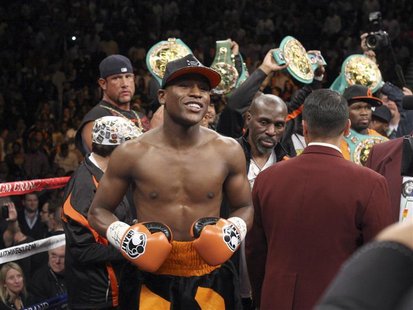 Floyd Mayweather Jr. of the U.S. stands in the ring before fighting WBC welterweight champion Victor Ortiz, also of the U.S., at the MGM Gra