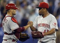Cincinnati Reds pitcher Francisco Cordero and catcher Ramon Hernandez celebrate their win during their inter-league baseball game in Toronto