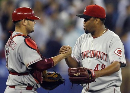 Cincinnati Reds pitcher Francisco Cordero and catcher Ramon Hernandez celebrate their win during their inter-league baseball game in Toronto