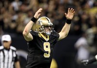 New Orleans Saints quarterback Drew Brees celebrates after a touchdown to Robert Meachem against the Detroit Lions in the fourth quarter dur