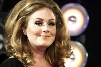 Singer Adele poses on arrival at the 2011 MTV Video Music Awards in Los Angeles