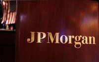 Flag hangs on the wall of the JP Morgan company stall on the floor of the New York Stock Exchange in New York