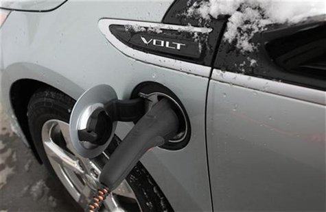 A 2012 Chevrolet Electric Volt gets charged at a charging station at a Chevrolet car sales lot in Troy, Michigan A 2012 Chevrolet Electric Volt gets charged at a charging station at a Chevrolet car sales lot in Troy, Michigan