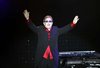 British singer Elton John greets his fans before his concert in Istanbul July 5, 2011. REUTERS/Osman Orsal (TURKEY - Tags: SOCIETY ENTERTAINMENT PROFILE)