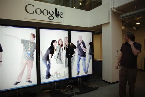 Software Engineer Arthur views a scrolling employee photo collage at the Google campus near Venice Beach, in Los Angeles Software Engineer Arthur views a scrolling employee photo collage at the Google campus near Venice Beach, in Los Angeles