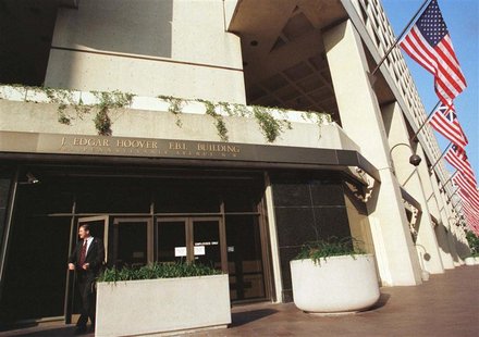 A man walks out of the Federal Bureau of Investigations (FBI) headquarters in Washington, July 23, 1999.
