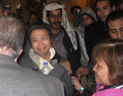 One of the two American tourists who were kidnapped is seen with Egyptian officials after her release in Saint Catherine One of the two American tourists who were kidnapped is seen with Egyptian officials after her release in Saint Catherine