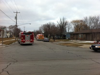 Police and rescue personnel at a residence on Erie Street in De Pere on Friday Feb. 3, 2012. (photo taken by reporter Terry Lee)