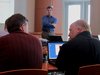 Two Collaborative Consulting confer during an orientation class at the technology firm's new office in downtown Wausau