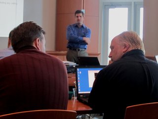 Two Collaborative Consulting confer during an orientation class at the technology firm's new office in downtown Wausau