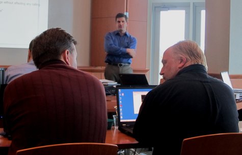 Two Collaborative Consulting confer during an orientation class at the technology firm's new office in downtown Wausau