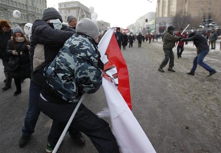 Opposition and pro-Putin activists tussle during a demonstration for fair elections in central Moscow Opposition and pro-Putin activists tussle during a demonstration for fair elections in central Moscow