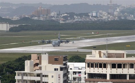A Hercules aircraft is seen on a runway at U.S. Marine Corps Air Station Futenma in Ginowan A Hercules aircraft is seen on a runway at U.S. Marine Corps Air Station Futenma in Ginowan