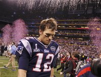 Patriots quarterback Brady leaves the field after their loss to the Giants in the NFL Super Bowl XLVI football game in Indianapolis