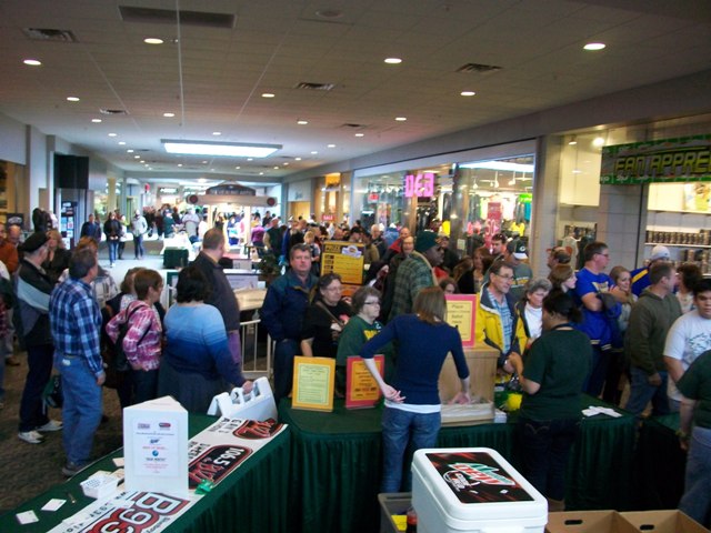 The hungry crowd waiting in line for their spoons.