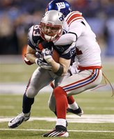 New England Patriots' Welker makes a catch on New York Giants' Ross in the second quarter of the NFL Super Bowl XLVI football game in Indian