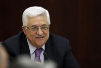Palestinian President Abbas smiles during a Palestinian Liberation Organization executive committee meeting in Ramallah