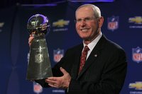 New York Giants head coach Coughlin holds up the Vince Lombardi Trophy the day after the NFL Super Bowl XLVI football game in Indianapolis