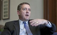 President and CEO of the Federal Reserve Bank of St. Louis James Bullard gestures during an interview at the Federal Reserve Bank of St. Lou