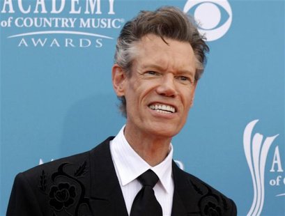 Singer Travis arrives at the 45th annual Academy of Country Music Awards in Las Vegas