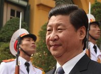 China's Vice President Xi Jinping walks past Vietnamese soldiers while leaving the Presidential Palace in Hanoi