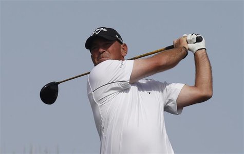 Bjorn of Denmark tees off on the 14th hole during the third round of the Qatar Masters tournament at the Doha golf club in Doha