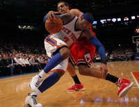 Knicks Anthony drives to the basket past Bulls Noah during their NBA basketball game at Madison Square Garden in New York