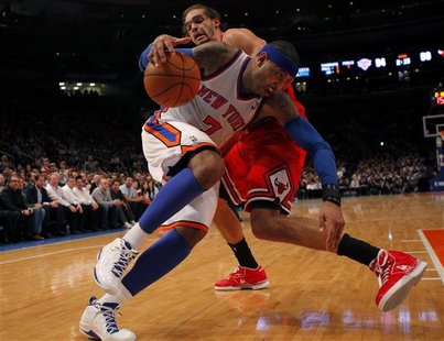 Knicks Anthony drives to the basket past Bulls Noah during their NBA basketball game at Madison Square Garden in New York Knicks Anthony drives to the basket past Bulls Noah during their NBA basketball game at Madison Square Garden in New York