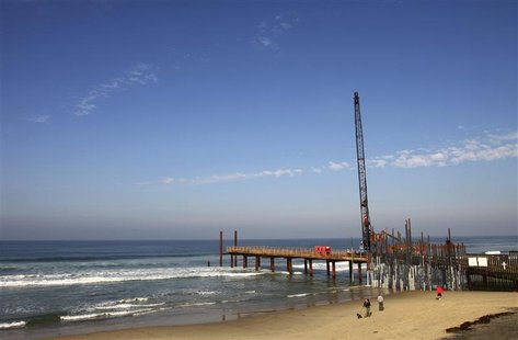 A crane is seen at the border fence as workers renovate the fence between the U.S. and Mexico in Tijuana