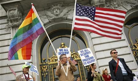 Billy Bradford waves flags outside City Hall after a judge lifted the Proposition 8 stay on same sex marriages at City Hall in San Francisco, California August 12, 2010.
Credit: Reuters/Robert Galbraith Billy Bradford waves flags outside City Hall after a judge lifted the Proposition 8 stay on same sex marriages at City Hall in San Francisco, California August 12, 2010.
Credit: Reuters/Robert Galbraith