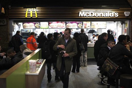 Customers are served at a Mcdonald's fast food restaurant in London Customers are served at a Mcdonald's fast food restaurant in London