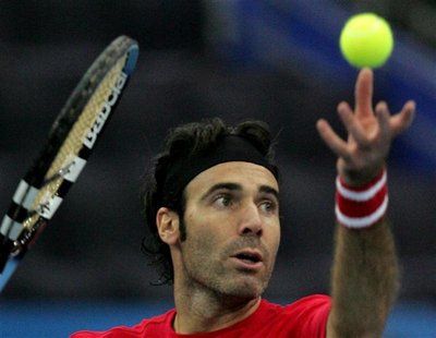 Corretja of Spain serves to Ivo Karlovic of Croatia during their second round match at the ... Corretja of Spain serves to Ivo Karlovic of Croatia during their second round match at the ...
