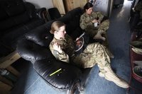 U.S. Army Specialist Nicole Derk of the C Company 3/82 Dustoff MEDEVAC cross stitches during her shift in Logar province