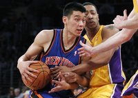 Newly acquired New York Knicks guard Jeremy Lin is fouled by Los Angeles Lakers' Andrew Goudelock during second half of an NBA basketball ga