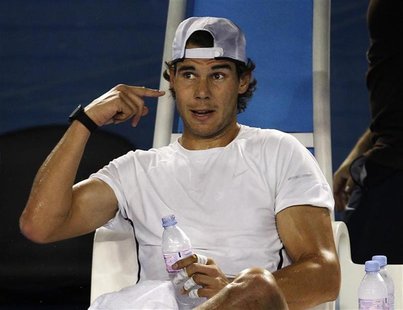 Spain's Rafael Nadal gestures during a training session on Rod Laver Arena in Melbourne Spain's Rafael Nadal gestures during a training session on Rod Laver Arena in Melbourne