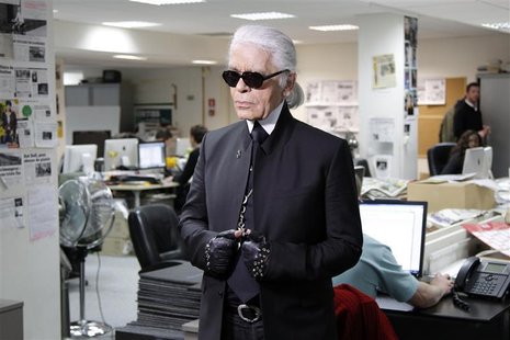 German designer Karl Lagerfeld guest edits at the Paris headquarters of the global free newspaper network Metro