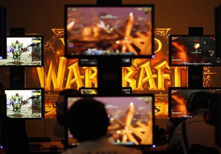 Visitors play ''World of Warcraft'' at an exhibition stand during the Gamescom 2011 fair in Cologne Visitors play ''World of Warcraft'' at an exhibition stand during the Gamescom 2011 fair in Cologne