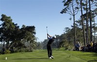 Tiger Woods tees off on the 10th hole at Spyglass Hill golf course during the first round of the Pebble Beach National Pro-Am golf tournamen