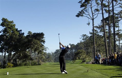 Tiger Woods tees off on the 10th hole at Spyglass Hill golf course during the first round of the Pebble Beach National Pro-Am golf tournamen Tiger Woods tees off on the 10th hole at Spyglass Hill golf course during the first round of the Pebble Beach National Pro-Am golf tournamen