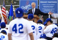 Los Angeles Dodgers owner Frank McCourt speaks during the unveiling of a new Dodgers baseball field for children in Compton, Los Angeles