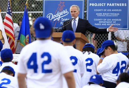 Los Angeles Dodgers owner Frank McCourt speaks during the unveiling of a new Dodgers baseball field for children in Compton, Los Angeles